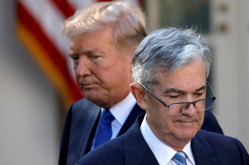 US President Donald Trump (rear) and US Federal Reserve chair Jerome Powell. Picture: REUTERS/CARLOS BARRIA